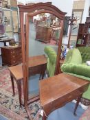 AN INLAID MAHOGANY HOWARD & SONS CHEVAL MIRROR WITH ARCHED PLATE AND SABRE LEGS. H.182 x W.80cms.