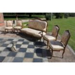 A FRENCH LOUIS XV STYLE CARVED FIVE PIECE SALON SUITE COMPRISING OF A SETTEE AND FOUR CHAIR