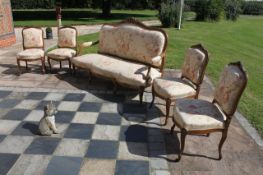 A FRENCH LOUIS XV STYLE CARVED FIVE PIECE SALON SUITE COMPRISING OF A SETTEE AND FOUR CHAIR