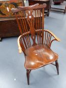 A GOOD EARLY 19th.C.COMB BACK ARMCHAIR WITH SHAPED CREST RAIL AND SADDLE SEAT WITH CRINOLINE