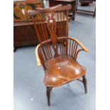 A GOOD EARLY 19th.C.COMB BACK ARMCHAIR WITH SHAPED CREST RAIL AND SADDLE SEAT WITH CRINOLINE