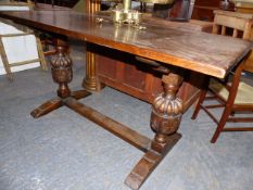 A GOOD 17th.C.STYLE OAK REFECTORY TYPE TABLE WITH PLANK TOP OVER CARVED BALUSTER SUPPORT AND TRESTLE