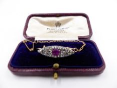 A PRECIOUS YELLOW METAL, TESTED AS GOLD, RUBY AND OLD CUT DIAMOND MARQUIS SHAPED BROOCH COMPLETE