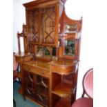 A CARVED AND INLAID MAHOGANY EDWARDIAN INVERTED BREAKFRONT DISPLAY CABINET WITH ASTRAGAL GLAZED