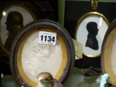 A PAIR OF TASSIE TYPE LATE 18th.C.OVAL PORTRAIT PLAQUES OF A GENTLEMAN AND A LADY AND TWO MIERS TYPE