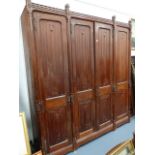 A LARGE VICTORIAN PUGINESQUE GOTHIC PINE LINEN PRESS. APPROX 230 x 253cms.