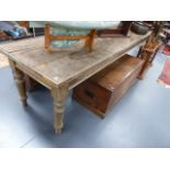 A LARGE RUSTIC OAK AND PINE SCULLERY TABLE ON TURNED LEGS. L.308 x W.75cms.