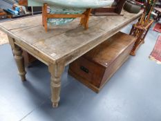 A LARGE RUSTIC OAK AND PINE SCULLERY TABLE ON TURNED LEGS. L.308 x W.75cms.