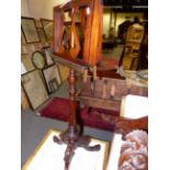 A VICTORIAN CARVED MAHOGANY ADJUSTABLE DUET/MUSIC STAND.