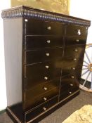 A 19th.C.EBONISED SIXTEEN DRAWER TALL CHEST WITH RIBBED CORNICE ON PLINTH BASE. H.152 x W.144 x D.