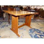 A SMALL HAND MADE ARTS AND CRAFTS SCOTTISH SCHOOL OAK AND WALNUT REFECTORY TABLE WITH PIERCED