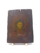 AN EARLY POLYCHROME PANEL OR ICON DECORATED WITH A PORTRAIT OF CHRIST, INSCRIBED AND UNFRAMED. 11