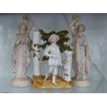 A PAIR OF BISQUE PORCELAIN FIGURINES N THE CLASSICAL STYLE AND A VICTORIAN VASE.