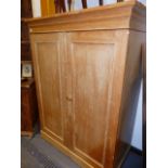 AN ANTIQUE PINE LOW TWO DOOR HALL CUPBOARD WITH PART FITTED INTERIOR. W.109cms.