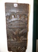 A 17th/18th.C.CARVED OAK ARCHITECTURAL ELEMENT WITH CROWN OVER AN EAGLE. H.55cms.