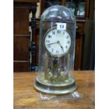 AN EARLY 20th.C.ANNIVERSARY CLOCK UNDER GLASS DOME. H.33cms.