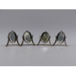 SET OF FOUR SILVER VICTORIAN MENU HOLDERS IN THE FORM OF MINIATURE OVAL MIRRORS. 1899 CHESTER,