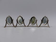 SET OF FOUR SILVER VICTORIAN MENU HOLDERS IN THE FORM OF MINIATURE OVAL MIRRORS. 1899 CHESTER,