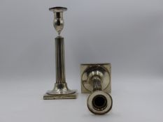 A PAIR OF WHITE METAL CONTINENTAL CANDLESTICKS STAMPED INDISTINCTLY BRUG LOCHER. TOTAL HEIGHT