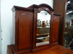 A MINIATURE VICTORIAN MAHOGANY TRIPLE WARDROBE WITH CENTRAL MIRRORED DOOR ENCLOSES DRAWERS FLANKED