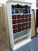 A PAINTED PINE KITCHEN SIDE CABINET FITTED WITH TWENTY SPICE DRAWERS AND SHELVES. W.113 x H.194cms.