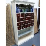 A PAINTED PINE KITCHEN SIDE CABINET FITTED WITH TWENTY SPICE DRAWERS AND SHELVES. W.113 x H.194cms.