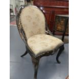 A VICTORIAN PAPIER MACHE SALON CHAIR WITH GILT AND INLAID MOTHER OF PEARL DECORATION, UPHOLSTERED