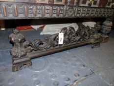 A VICTORIAN CAST IRON FIRE FENDER. W.82cms.