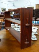 A TEAK COTSWOLD SCHOOL TWO SHELF LOW BOOKCASE. H.70 x W.138cms.