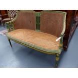 AN ANTIQUE FRENCH CARVED AND PAINTED LOUIS XVI STYLE CANE SEAT AND BACK SETTEE. W.130cms.