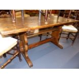 A 19th.C.OAK AND ELM TAVERN TYPE TABLE ON TRESTLE SUPPORTS. 160 x 68cms.