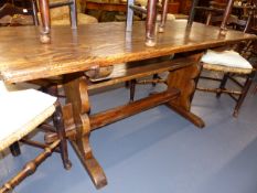 A 19th.C.OAK AND ELM TAVERN TYPE TABLE ON TRESTLE SUPPORTS. 160 x 68cms.