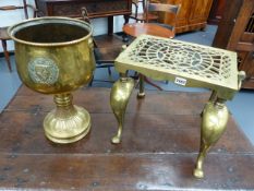 A GEORGIAN CAST BRASS FOOTMAN AND A CONTINENTAL LARGE BRASS CHALICE WITH COAT OF ARMS.