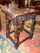 A 17th.C.AND LATER OAK JOINT STOOL WITH CARVED DECORATION. W.45cms