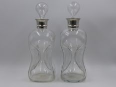 TWO PINCHED GLASS DECANTERS WITH SILVER HALLMARKED COLLARS, 1904 LONDON, STAMPED ASPREY LONDON,