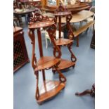 A PAIR OF VICTORIAN ROSEWOOD THREE TIER CORNER WHAT NOTS. H.131cms.