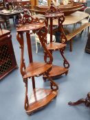 A PAIR OF VICTORIAN ROSEWOOD THREE TIER CORNER WHAT NOTS. H.131cms.