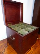 A REGENCY MAHOGANY LIFT TOP DECANTER BOX, THE INTERIOR DIVIDED TO HOLD NINE BOTTLES, WITH BRASS