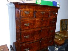 AN INLAID WALNUT EARLY GEORGIAN AND LATER SIX DRAWER HIGH CHEST ON A ONE DRAWER BASE WITH SHAPED