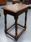 A 17th.C.AND LATER OAK JOINT STOOL WITH CARVED FRIEZE AND SPLAY LEGS.