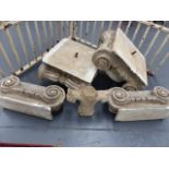 A GROUP OF ANTIQUE CARVED STONE ARCHITECTURAL ELEMENTS IN THE FORM OF SCROLLED CAPITALS. (5)