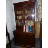 A 19th.C.MAHOGANY BOOKCASE WITH ASTRAL GLAZED DOORS OVER ARRANGEMENT OF SMALL DRAWERS AND ENCLOSED