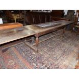 AN 18th.C.AND LATER OAK REFECTORY TABLE WITH DRAW LEAF PLANK TOP OVER TURNED LEGS UNITED BY