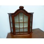A SMALL WALNUT WALL MOUNTED DISPLAY CABINET IN THE DUTCH MANNER. H.68cms.