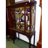 A CARVED MAHOGANY CHINESE CHIPPENDALE STYLE GLAZED DISPLAY CABINET WITH PIERCED GALLERY, ASTRAGAL