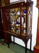 A CARVED MAHOGANY CHINESE CHIPPENDALE STYLE GLAZED DISPLAY CABINET WITH PIERCED GALLERY, ASTRAGAL