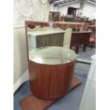 AN UNUSUAL ROSEWOOD MIRROR BACK SIDE CABINET OF BOWED FORM IN THE ART DECO TASTE. H.106 x W.106 x