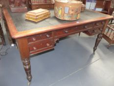 A MAHOGANY MID 19th.C.GENTLEMAN'S LIBRARY WRITING TABLE WITH INSET BLACK LEATHER TOP, FIVE APRON