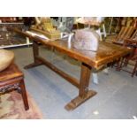 A 17th.C.AND LATER OAK REFECTORY TABLE WITH A SINGLE PLANK TOP, NOW WITH BREADBOARD ENDS ON SQUARE