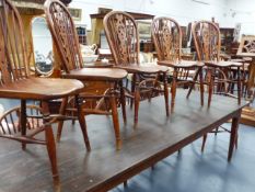 A HARLEQUIN SET OF ELEVEN YEW WOOD, BEECH AND ELM WINDSOR CHAIRS WITH FLEUR DE LYS PANEL BACKS TO